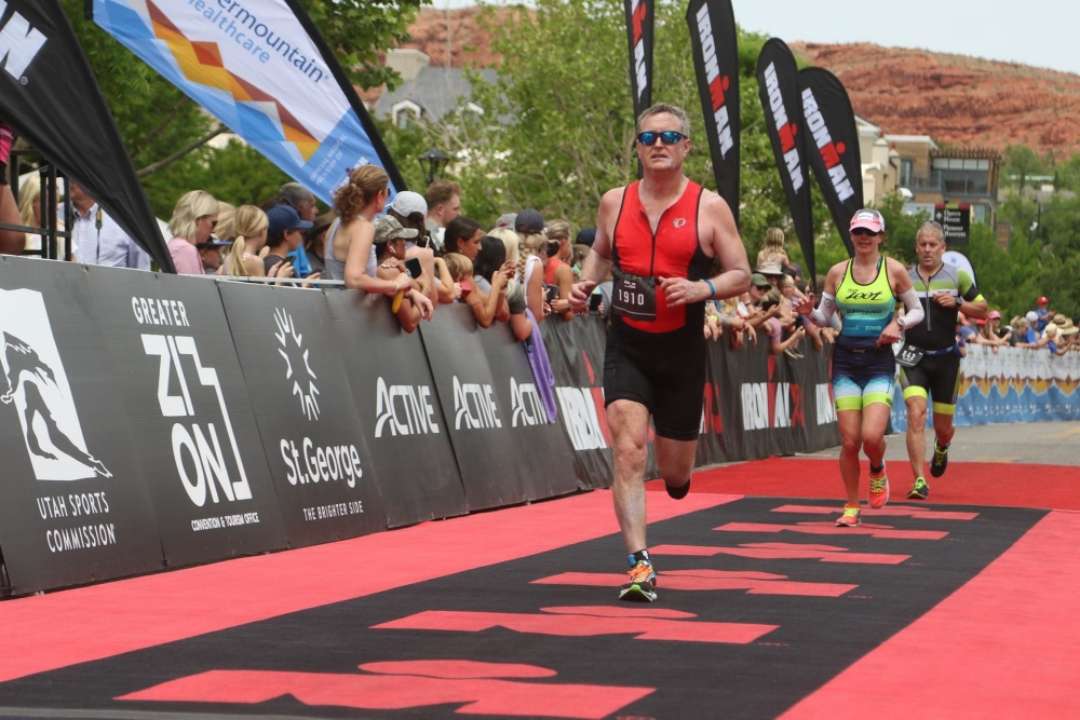 Ed Dressel running and competing in an Ironman Triathlon in 2021